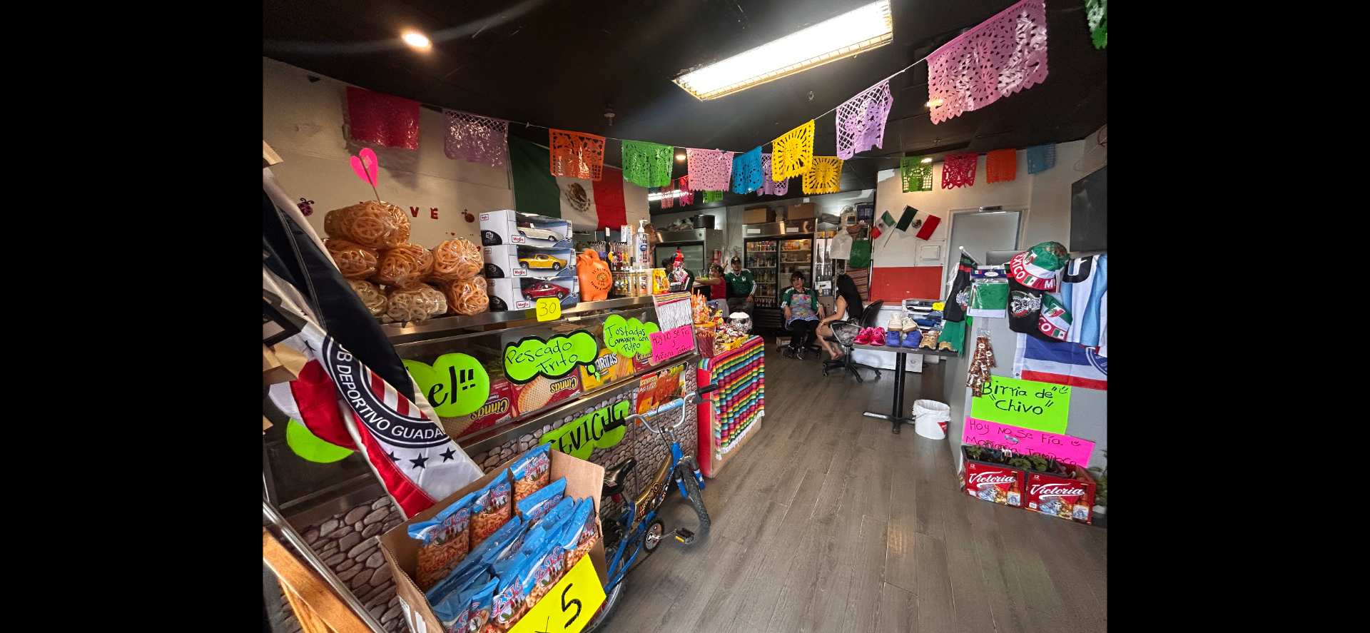 Mexican grocery and treats display inside El Estorbo